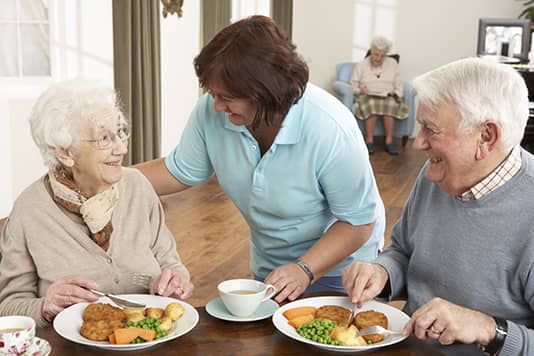 senior citizens having a meal