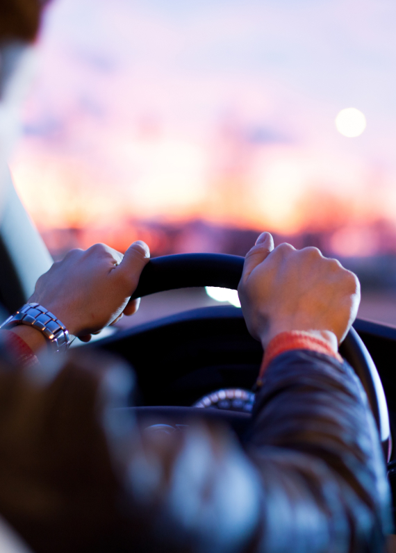 Hands correctly placed on the wheel to avoid a car accident