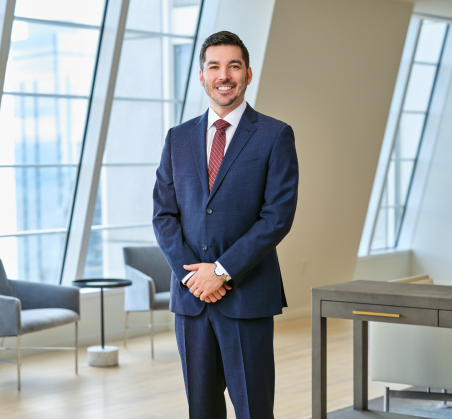 Chicago injury attorney David L. Durán standing in Salvi, Schostok & Pritchard's Chicago law office